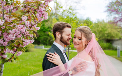 A bride and groom having wedding photo at an outdoor setting