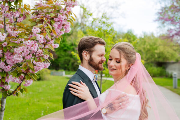 A bride and groom having wedding photo at an outdoor setting