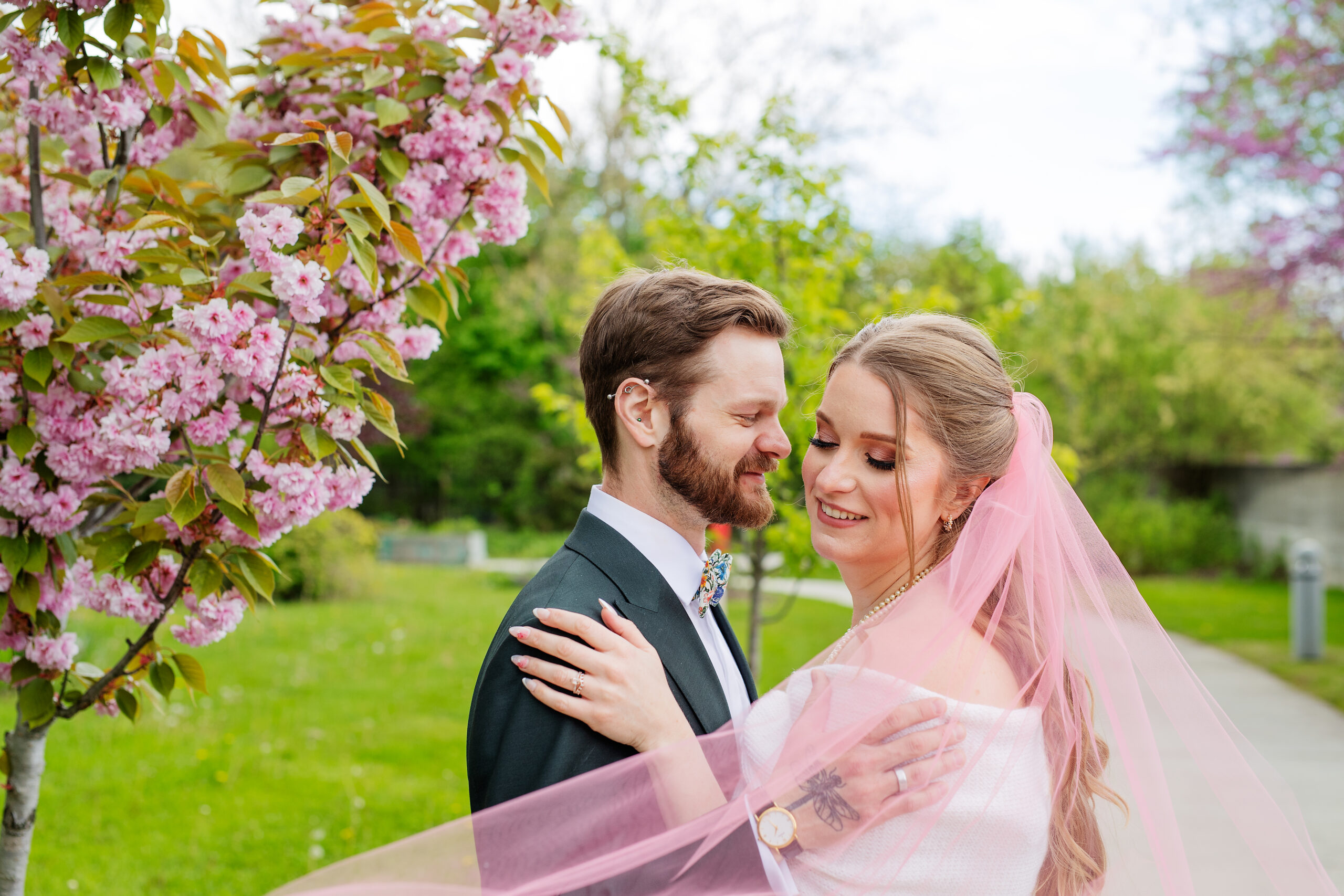 A bride and groom having wedding photo at an outdoor setting