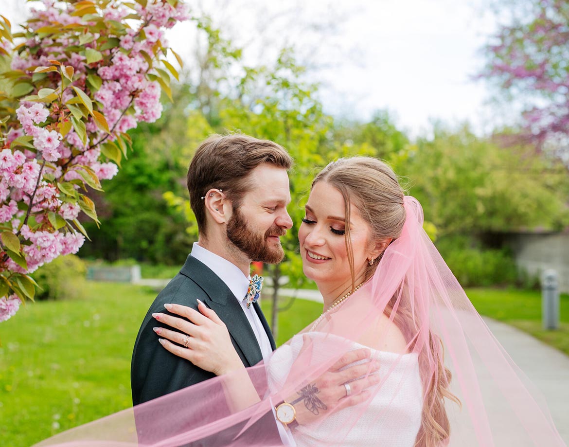 A bride and groom having wedding photo at an outdoor setting